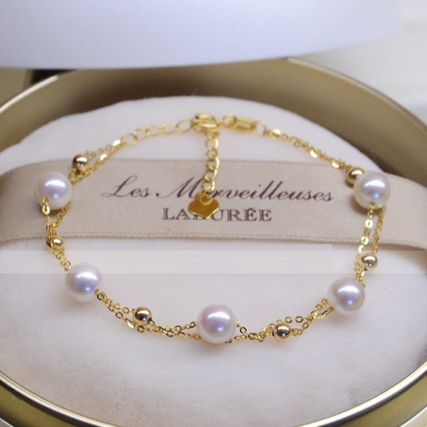 Pulsera de doble capa de oro de 18 quilates con perlas de agua de mar: elegancia en la perfección 